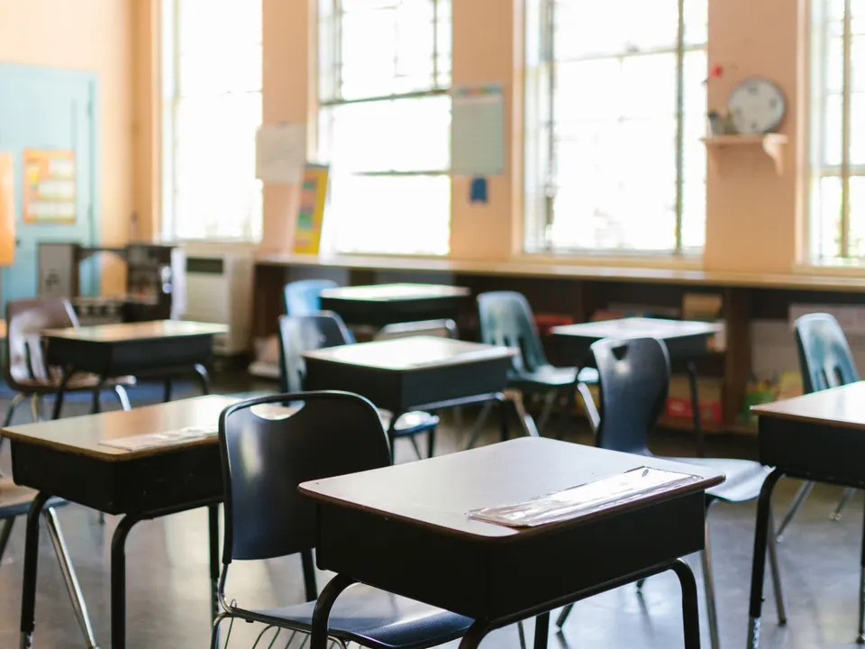 Sample image: Rows of desks in a bright classroom